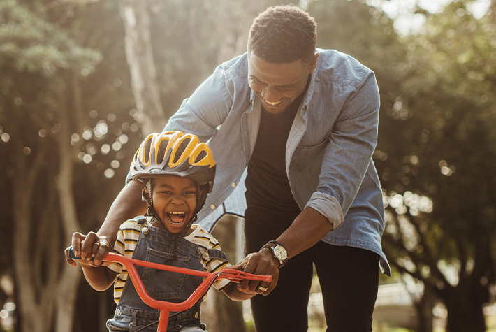 A young boy riding a bike